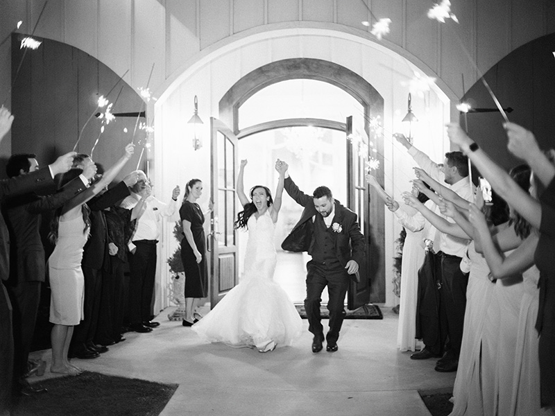 bride-and-groom-exiting-the-reception-grand-exit-at-the-french-farmhouse-collinsville-tx