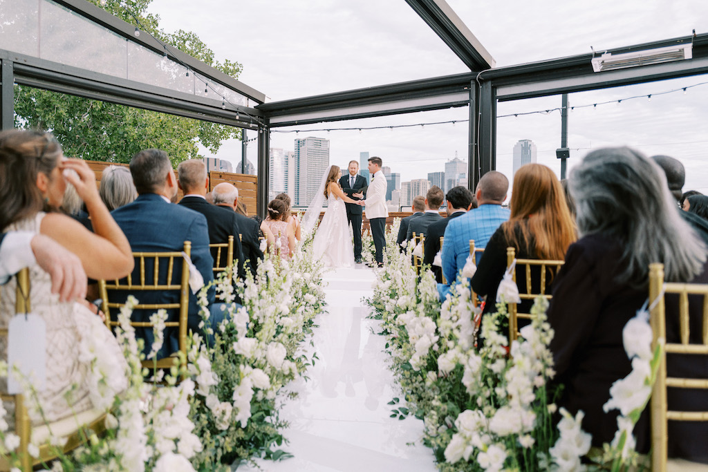 Wedding Ceremony at DEC on Dragon rooftop view with florals by Event Stems